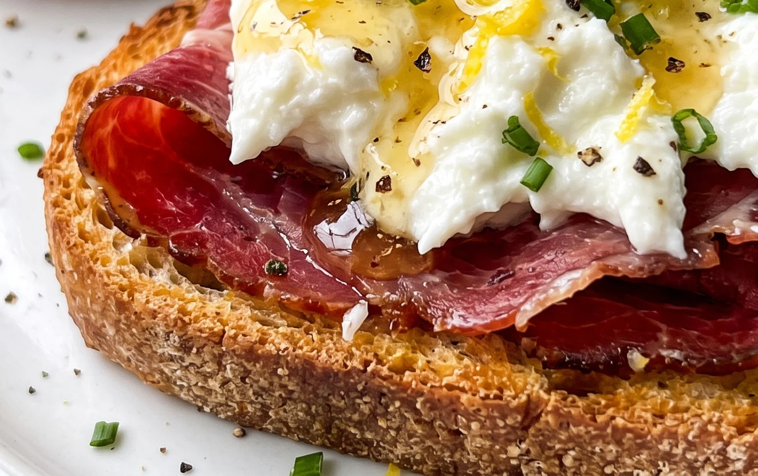 Beef Prosciutto Crostini with Burrata and Lemon Honey Drizzle